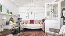 Escape with a book in the conservatory.