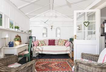 Escape with a book in the conservatory.