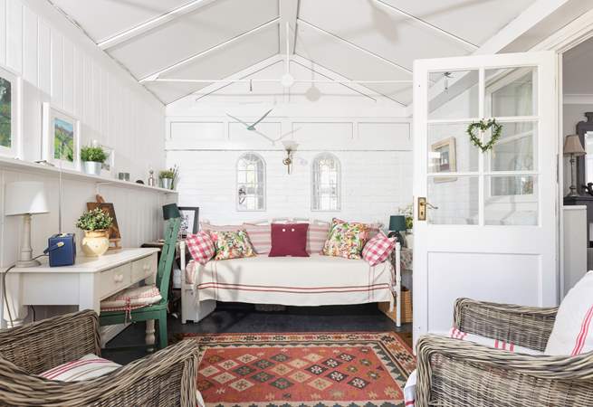 Escape with a book in the conservatory.