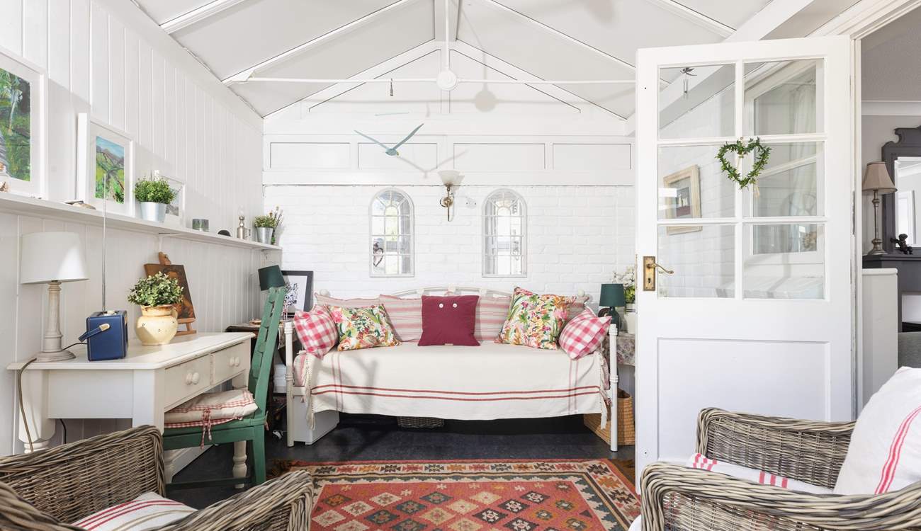 Escape with a book in the conservatory.