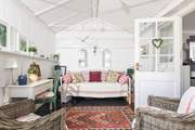 Escape with a book in the conservatory.