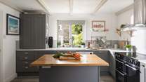 The kitchen is modern and well-equipped.