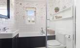 Relax in the family bathroom with bath and separate shower. - Thumbnail Image