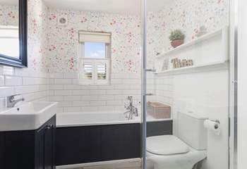 Relax in the family bathroom with bath and separate shower.