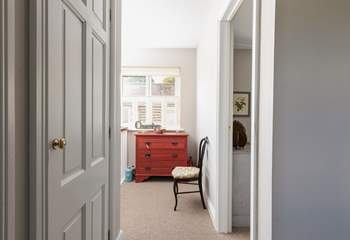 The bedrooms and bathroom lead off the hallway.