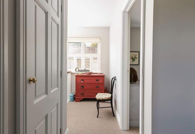The bedrooms and bathroom lead off the hallway.