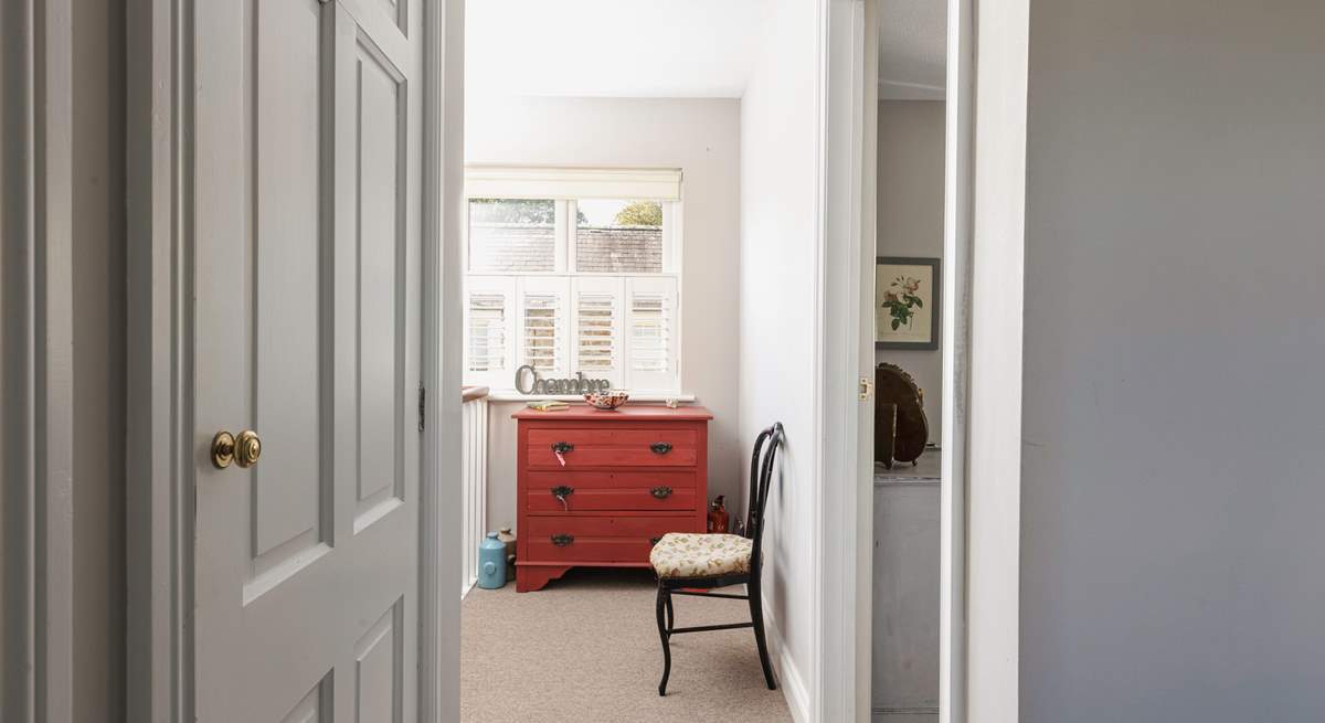 The bedrooms and bathroom lead off the hallway.