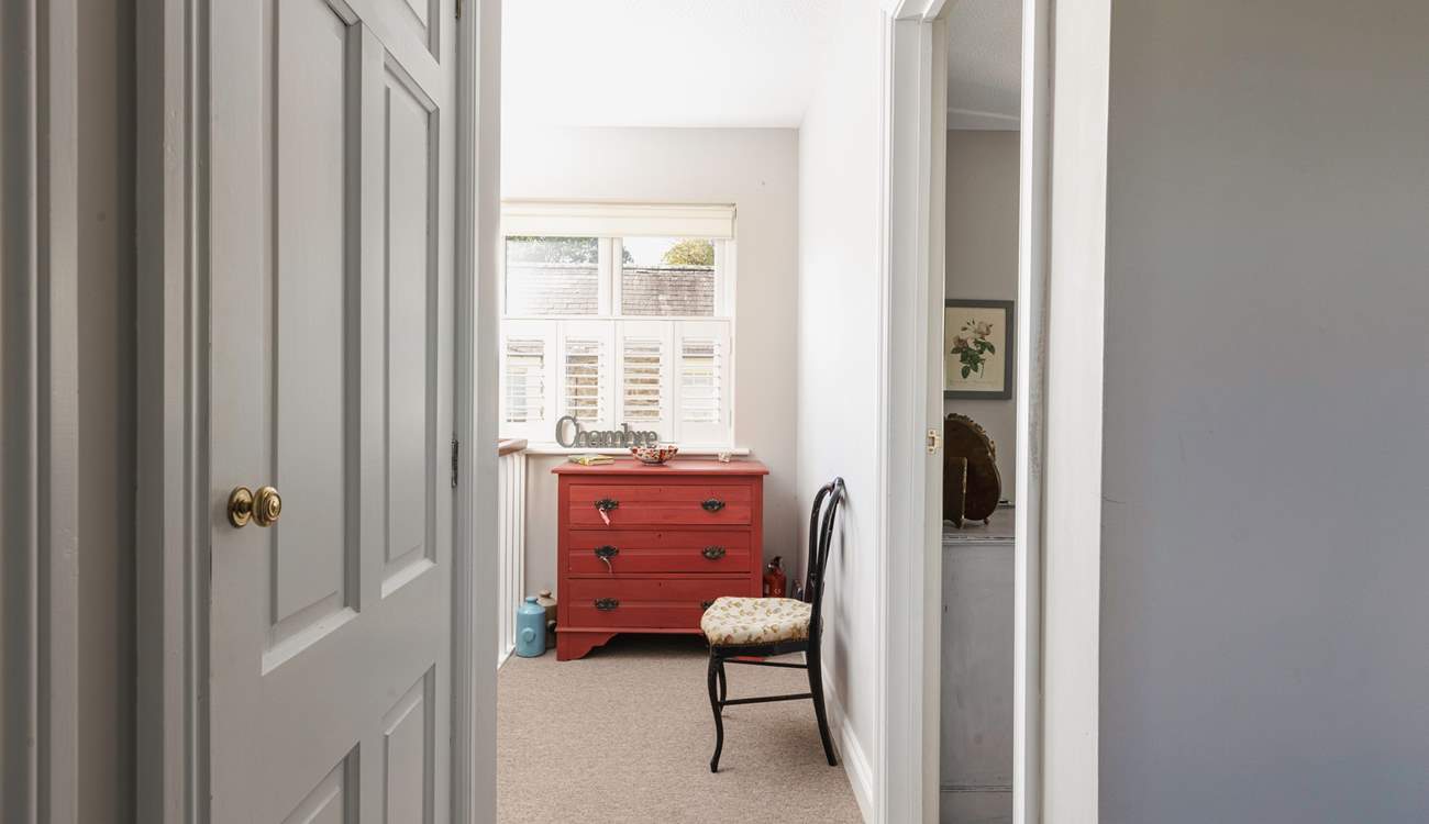 The bedrooms and bathroom lead off the hallway.