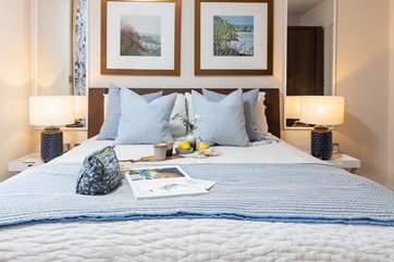 The king-size bedroom on the first floor has a bed that's dressed to impress.