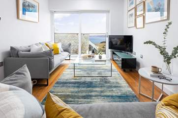 The large picture window makes the most of the setting, you are sure to spend hours simply gazing out to sea.
