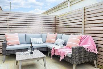 The sheltered decking area is very private and a lovely spot to sit out and enjoy morning coffee or a sundowner.