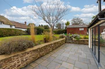 A view of the garden, looking on to your parking area (adjacent to the shed). There will be some patio furniture available during your stay.
