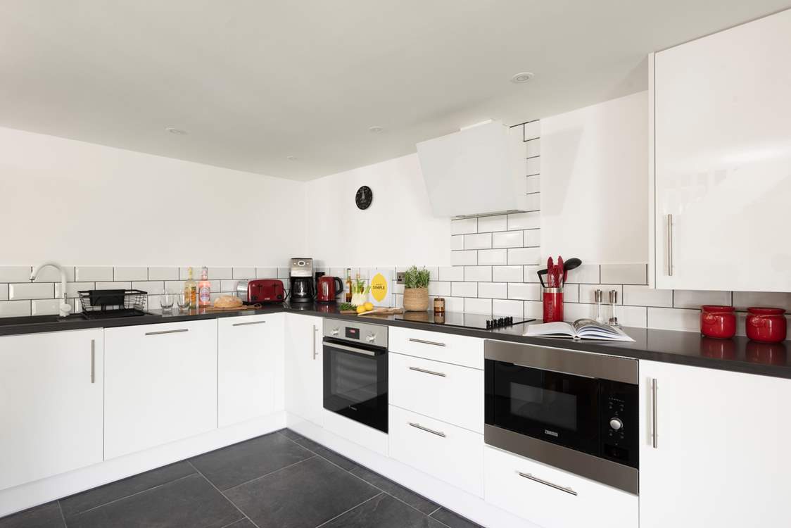 Dynnargh Barn comes with a sleek and modern kitchen.