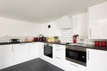 Dynnargh Barn comes with a sleek and modern kitchen.