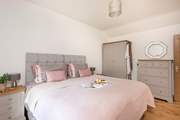 Calming pastel shades in the second bedroom.