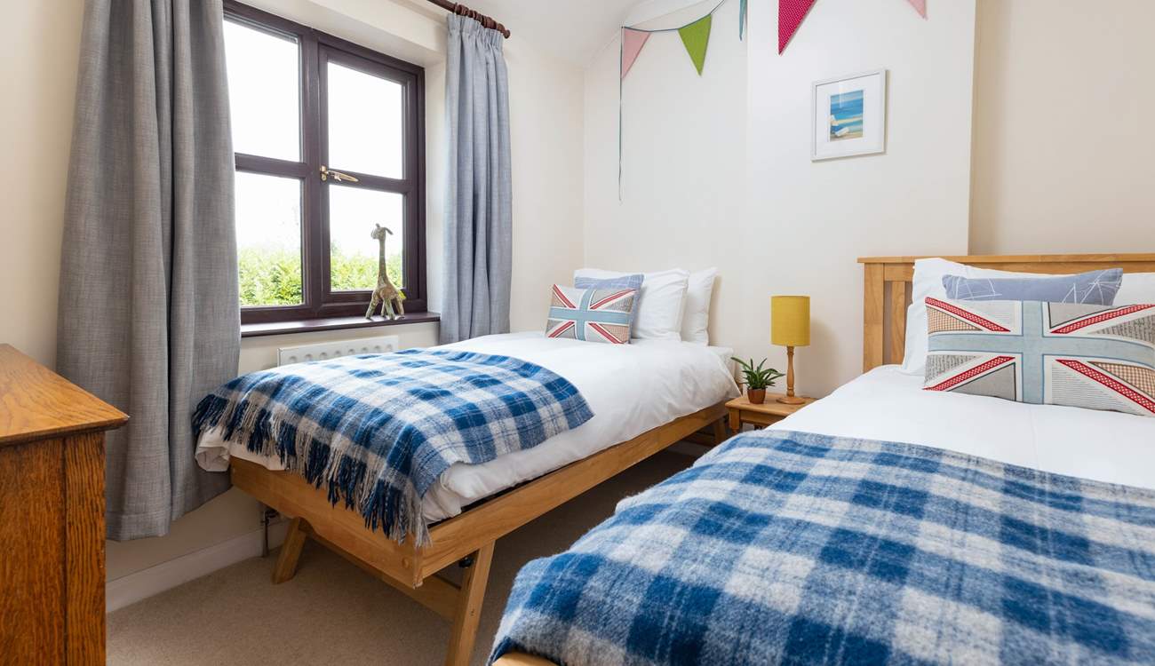 Bedroom four is home to these fabulous twin beds.