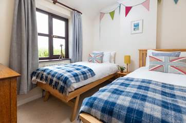 Bedroom four is home to these fabulous twin beds.
