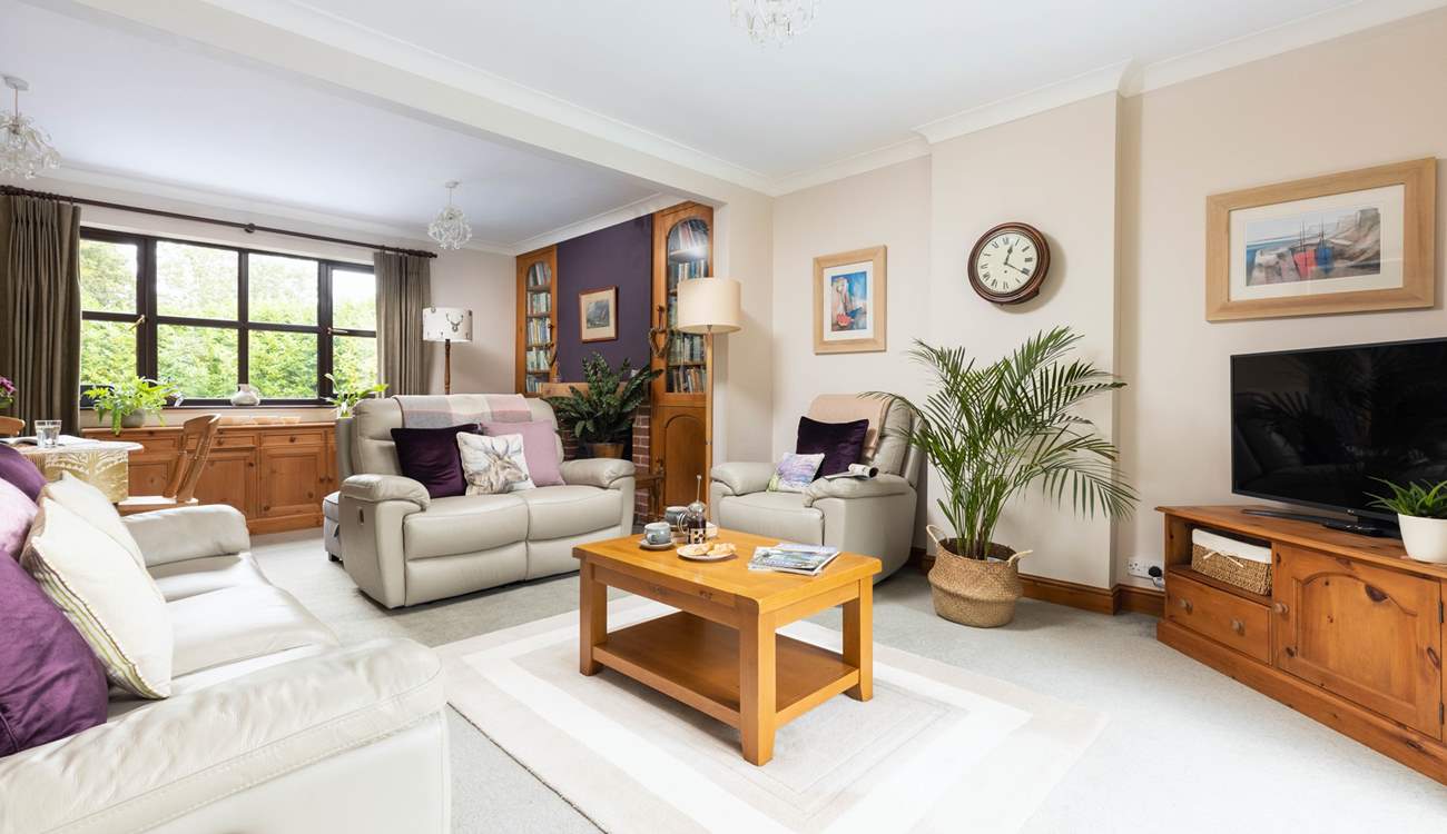 The sitting-room is spacious yet cosy.