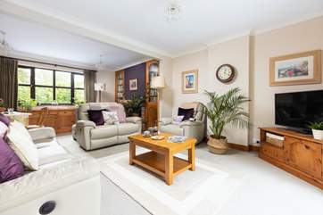 The sitting-room is spacious yet cosy.