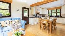 The open plan kitchen, dining and snug area. Perfect for whipping up that feast as a team effort.