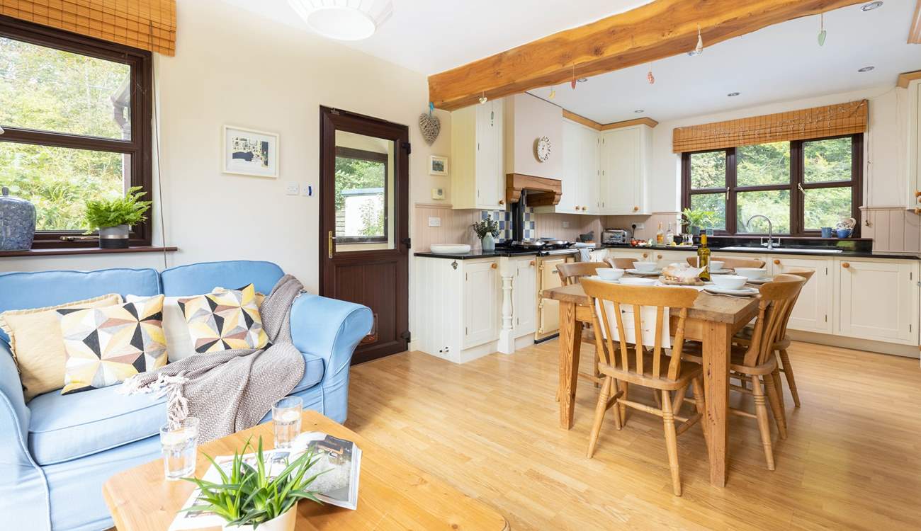 The open plan kitchen, dining and snug area. Perfect for whipping up that feast as a team effort.
