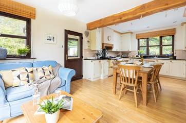 The open plan kitchen, dining and snug area. Perfect for whipping up that feast as a team effort.