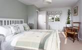 The super main bedroom has a king-size bed. - Thumbnail Image