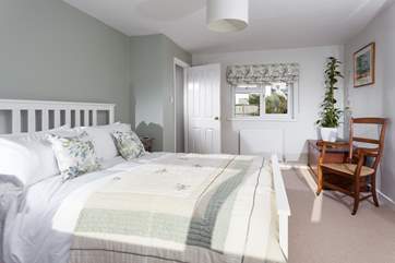 The super main bedroom has a king-size bed.