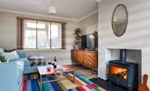 The cosy sitting-room has a fabulous wood-burner making this property perfect throughout the seasons. - Thumbnail Image