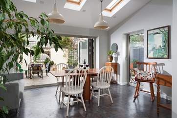 The fabulous extension lets the light flood in through bi-fold doors.