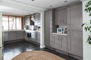 The open plan kitchen/diner is flooded with light.