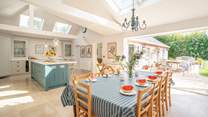 The luxurious kitchen/dining-room showcases plenty of light and space. 