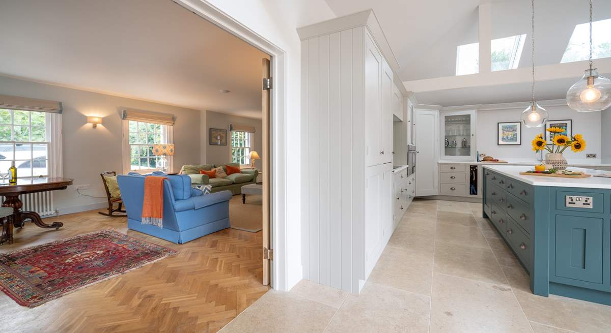 Double doors can be opened up into the sitting-room to create an open plan feel. 