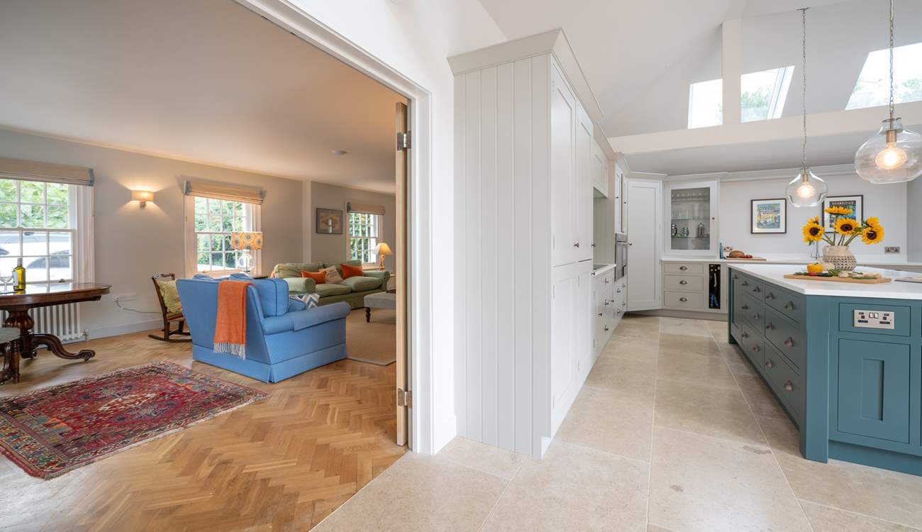 Double doors can be opened up into the sitting-room to create an open plan feel. 