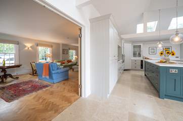 Double doors can be opened up into the sitting-room to create an open plan feel.