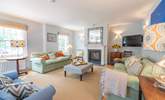 The welcoming sitting-room has the benefit of a wood-burner. - Thumbnail Image