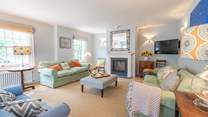 The welcoming sitting-room has the benefit of a wood-burner.