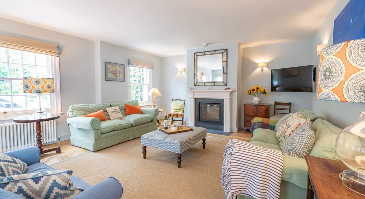 The welcoming sitting-room has the benefit of a wood-burner.