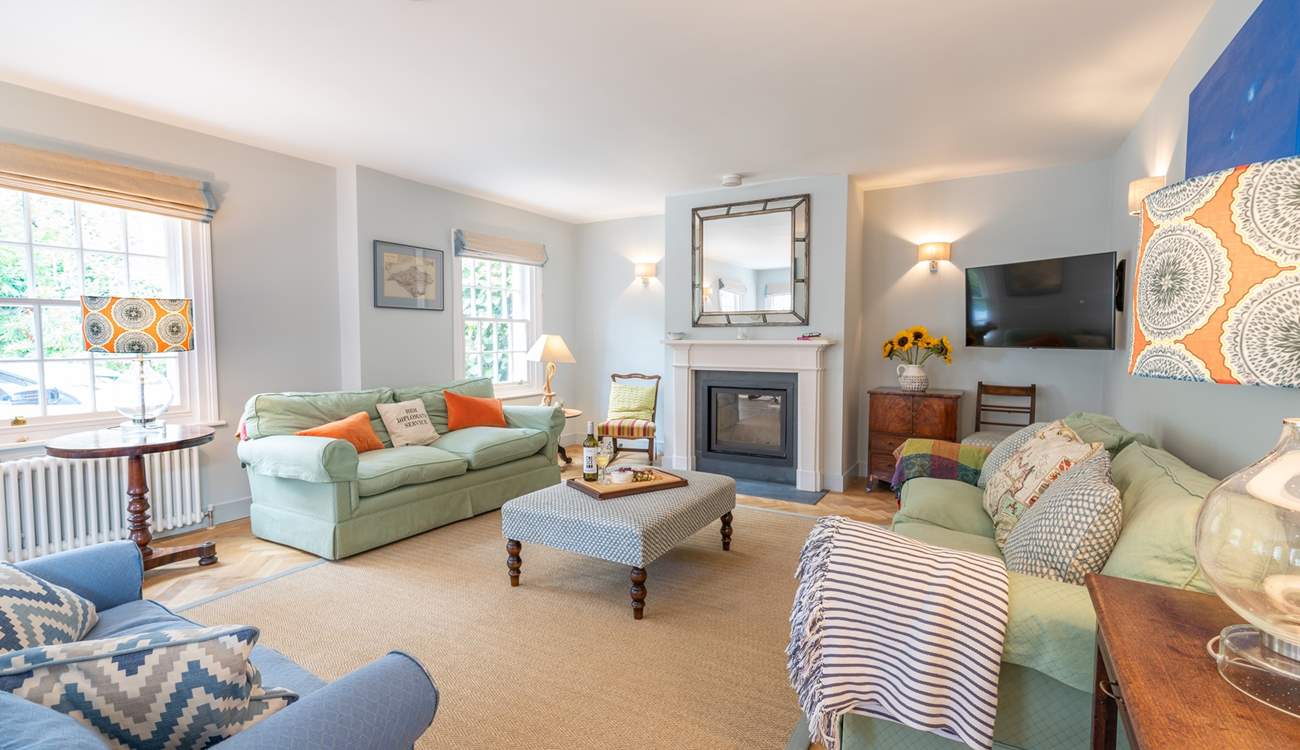 The welcoming sitting-room has the benefit of a wood-burner.