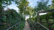 Cara Cottage is a short walk to the beach, accessed from the unmade lane and steps to the beach.