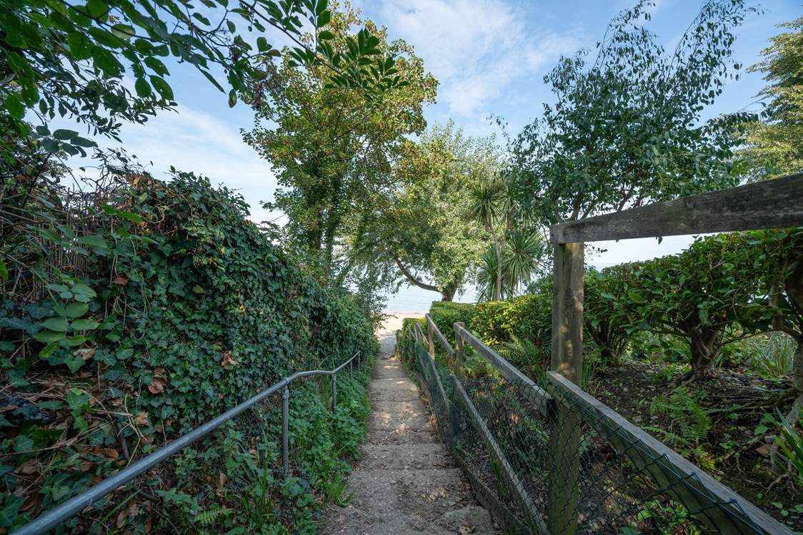 Cara Cottage is a short walk to the beach, accessed from the unmade lane and steps to the beach.