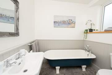 The original roll-top bath has been restored by the owners.