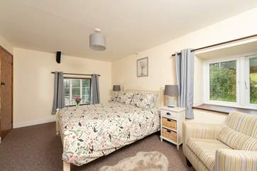The pretty main bedroom has views in both directions.