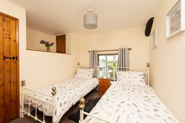 Pretty linen gives this room a cosy feel.