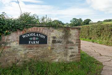 Keep an eye out for the entrance to Woodlands Farm.