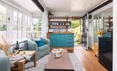 To the right, you can see the fridge and microwave. The kettle and coffee machine are also positioned here. The plug-in double hob is tucked away in the kitchen cupboards.  - Thumbnail Image