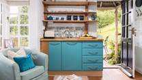 The quaint kitchen has everything you need to prepare a quick bite to eat.