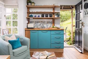 The quaint kitchen has everything you need to prepare a quick bite to eat.
