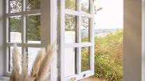 Open the windows and let the light flow through.