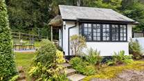 The traditional cottage style windows and the sweetest thatched porch make this little hideaway a picture-perfect haven.